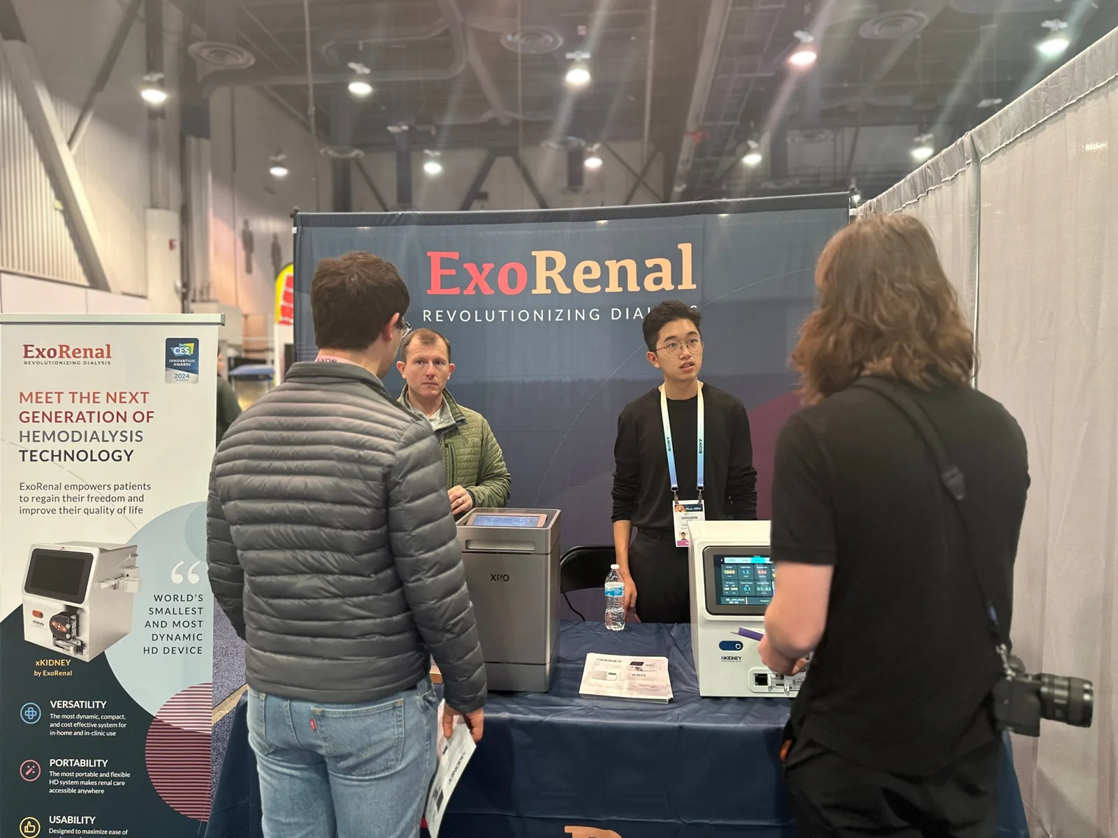 Our team talking with visitors at the Exorenal booth in the Digital Health hall